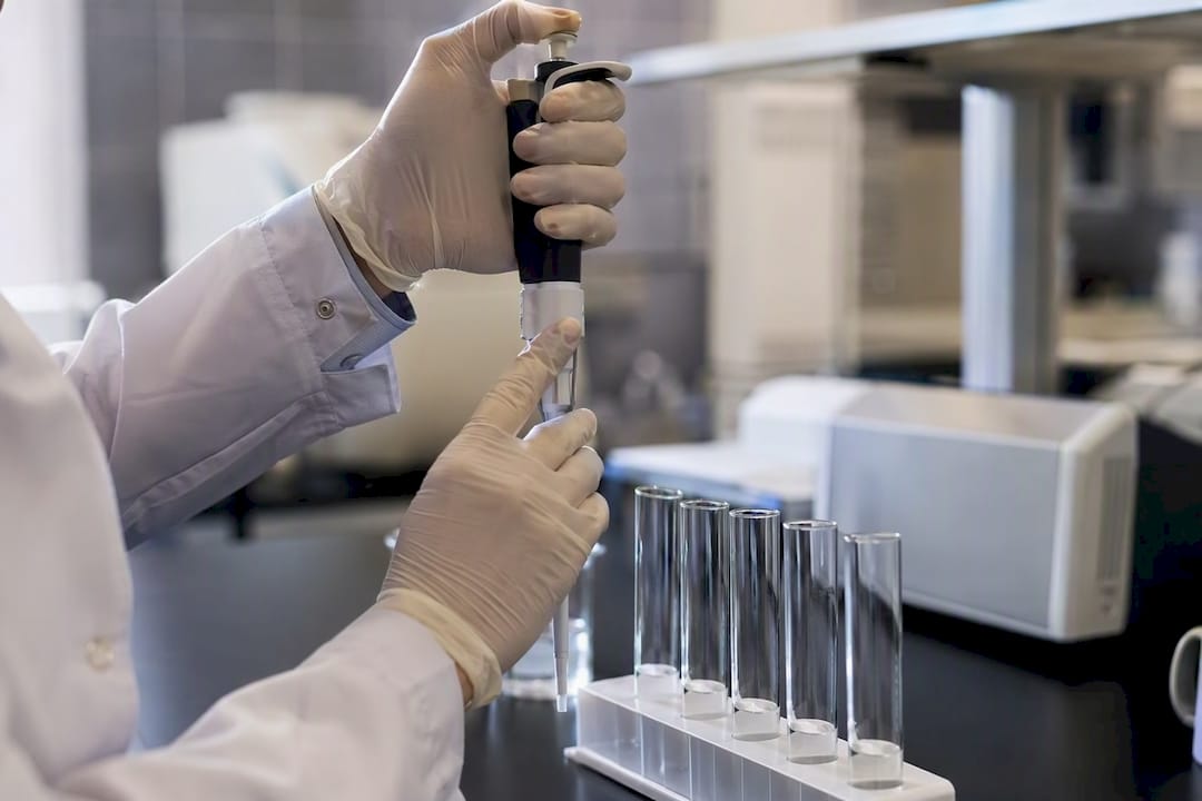 Pipette and test tubes in lab